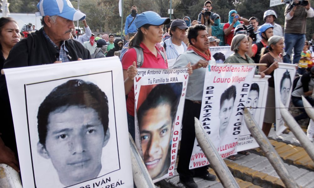 Parents of  missing students participate in a protest demanding justice and clarification of the disappearance of 43 students from Ayotzinapa, on January 12, 2015, in front of the 35th Military Zone, in Chilpancingo, Guerrero State, Mexico. Students and relatives of 43 missing aspiring teachers stormed a Mexican military base on Monday in the city where they vanished, prompting soldiers to repel them with tear gas. The protesters traveled to Iguala, in the southern state of Guerrero, to demand to search the barracks because they believe the missing young men may have been hidden there. AFP PHOTO/ JESUS GUERREROJESUS GUERRERO/AFP/Getty Images ** OUTS - ELSENT, FPG - OUTS * NM, PH, VA if sourced by CT, LA or MoD **